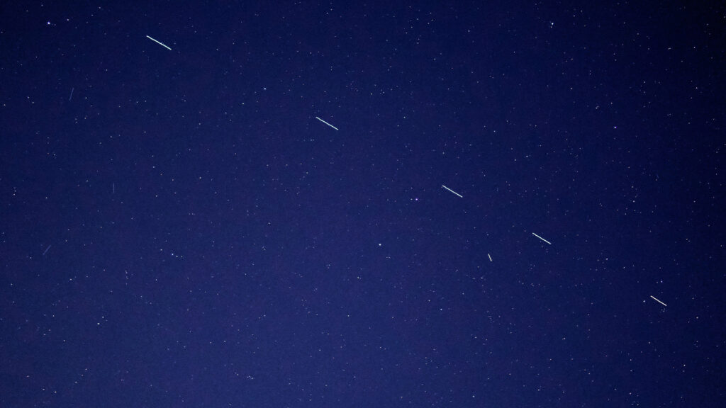 The Starlink 3 satellite train in the evening sky